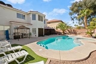 View of pool featuring a gazebo and a patio area