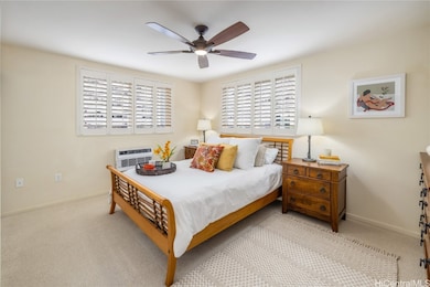 Corner primary bedroom is spacious with lots of li