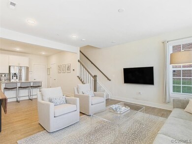 Walk in the front door of this end unit into the G