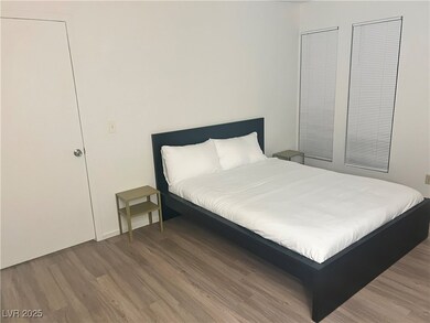 Bedroom featuring wood finished floors