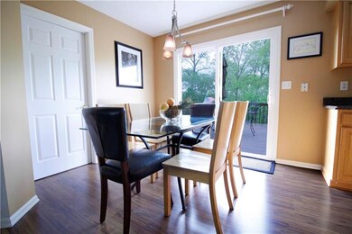 Eat-in kitchen with slider to deck makes entertaining a snap. First floor laundry is located behind the door