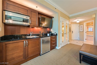 Kitchen with stainless steel microwave, a sink, br