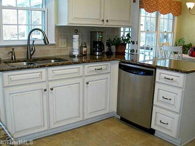 Kitchen. Totally renovated kitchen with painted w/glaze cabinets and tile floor