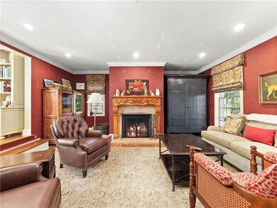 Family room with log burning fireplace with handso