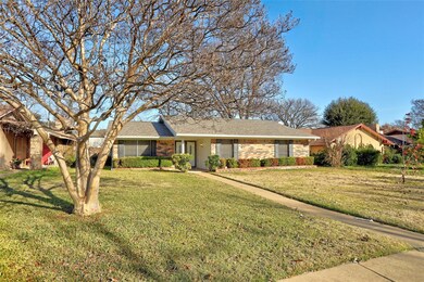 Single story home with a front yard