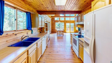 Kitchen featuring white appliances, a healthy amou