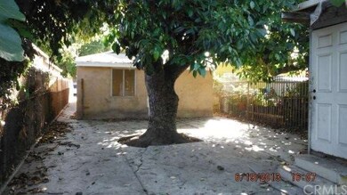 Rear of House and patio Area - Large Avacado Tree