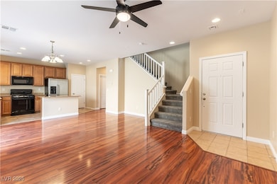 Unfurnished living room with light wood-style floo