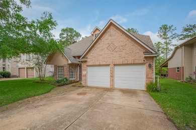 This charming home features a brick facade with a two-car garage and a well-maintained front yard. Located in a peaceful neighborhood, it offers a cozy and inviting exterior with lush greenery and mature trees.