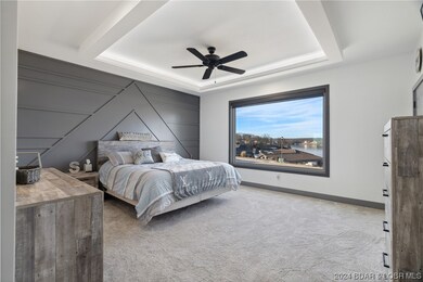 The master bedroom is spacious, beautiful and has