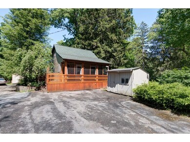 Large drive with storage shed  has ample parking a