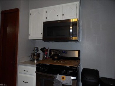 This Kitchen is Spacious and there's the Microwave