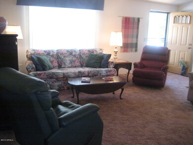family room with covered furniture