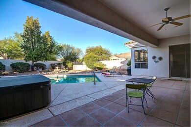 Covered patio overlooking pool & hot tub