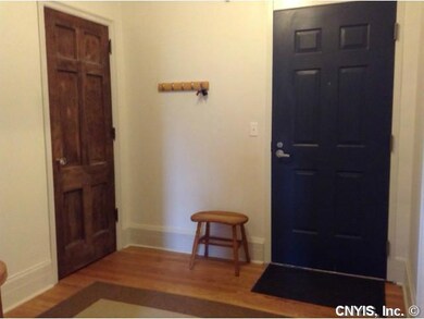 Foyer spacious foyer with hardwoods and a deep clo