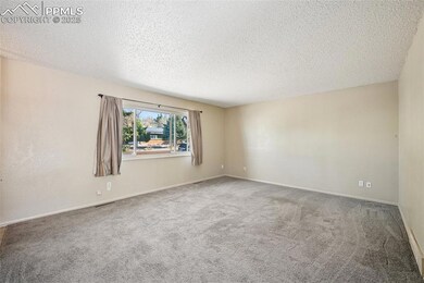 Large, bright living room with neutral colors