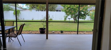 View onto the screened patio and the fully fenced