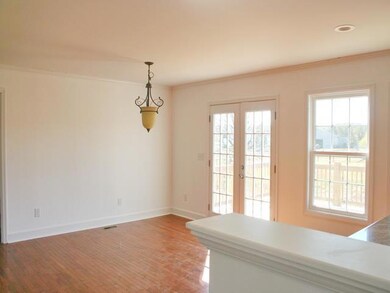 12x16 ft dining area, french doors to deck.