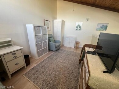 Bedroom featuring wooden ceiling, light wood finis