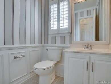 Renovated Powder Room with picture frame molding a
