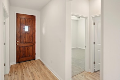 Entrance foyer with light wood-type flooring and 