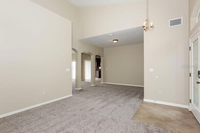 LIVING ROOM LOOKING AT MAIN ENTRANCE (RIGHT) DINNING ROOM (CENTER)