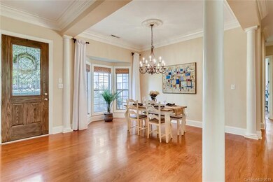 Large, well lit foyer and dining room with chunky 