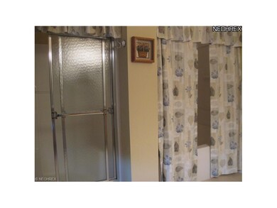 Walk-in shower PLUS soaking tub with additional overhead shower in master bath.