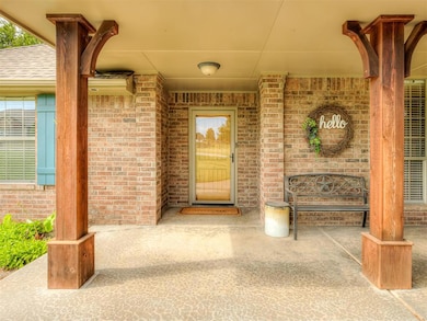 Property entrance with a porch and brick siding