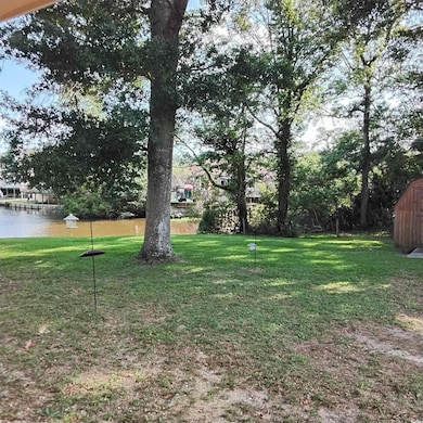 View of green lawn with a water view