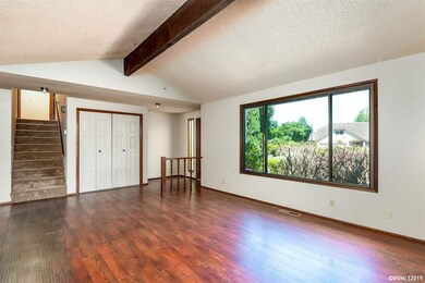 Stairs lead to 3 bedrooms and a full bathroom