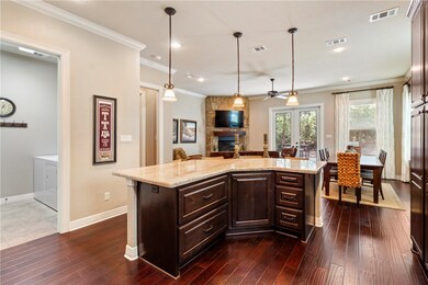 Kitchen with a fireplace, washer and clothes dryer
