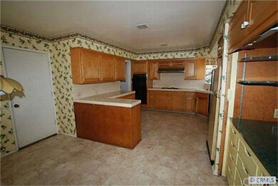 Informal dining area on left, neighboring the kitc