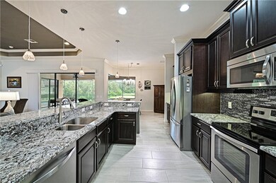 The kitchen sparkles and begs to entertain.