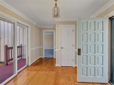 Bright foyer has sliders giving a view of the lake