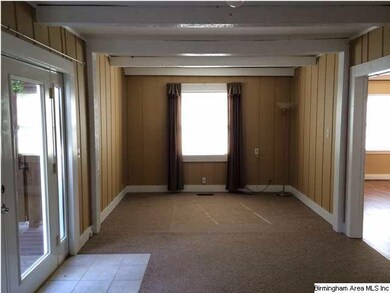 Den is spacious with french doors to the hot tub a