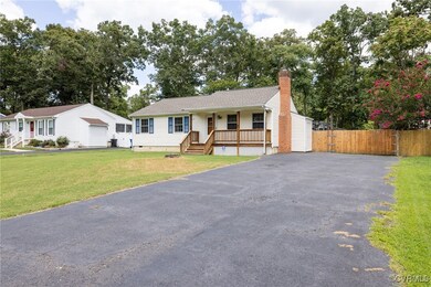 Single story home with a front lawn
