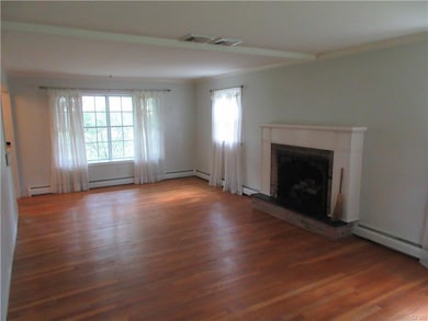 Plenty of light in the living room with wood burni