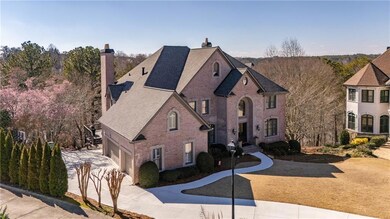 View of front of house featuring brick siding, dri