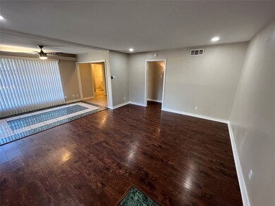Empty room with dark wood finished floors, recessed lighting, and ceiling fan