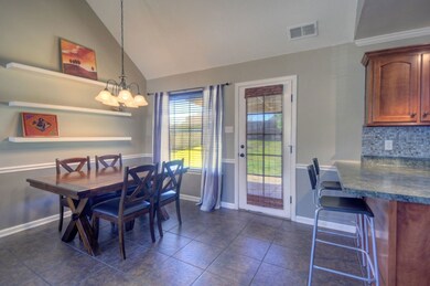 The dining area is open to the kitchen and living room.