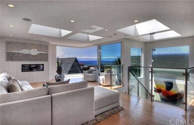 Living room with fireplace and beautiful ocean vie
