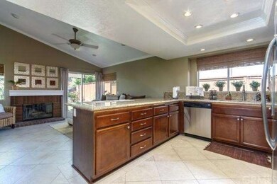 PARTIAL VIEW OF THE KITCHEN AND FAMILY ROOM AREAS.