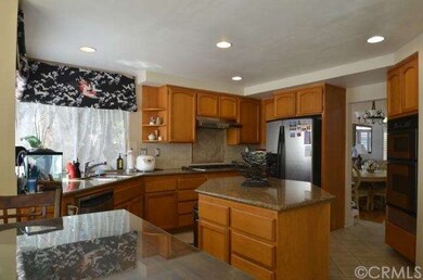 Large kitchen with granite countertops.