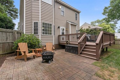 Before we step inside, here's the back with large deck, patio, and firepit.  Outside speakers also convey!