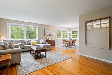 Open concept living and dining with hardwood floor