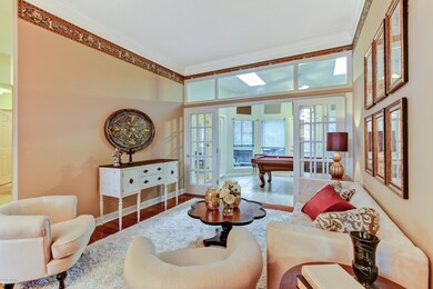 LIVING ROOM & VIEW OF GAME ROOM