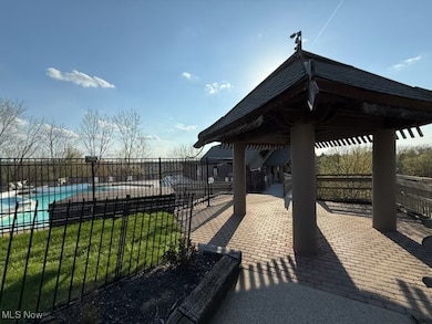 View of community featuring a patio area and a swimming pool