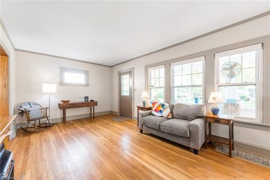 Modern replacement windows are flanked by original leaded glass.
