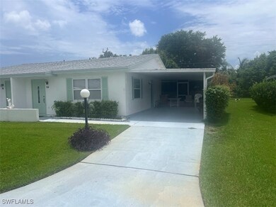 View of front facade featuring driveway,javascript